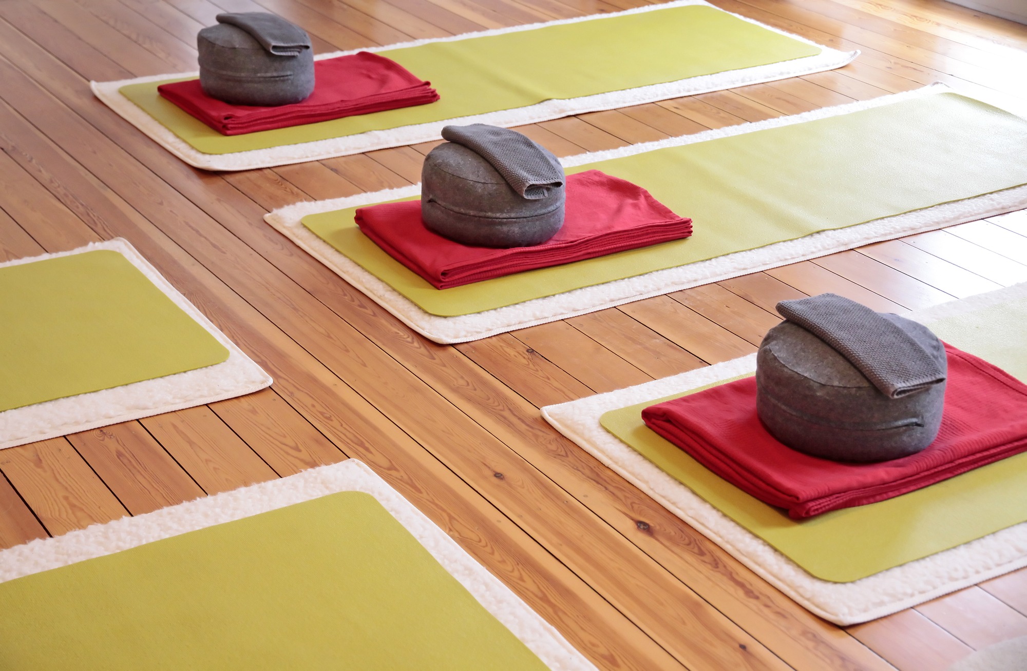 Close-up of yoga mats and yoga cushion in a yoga studio