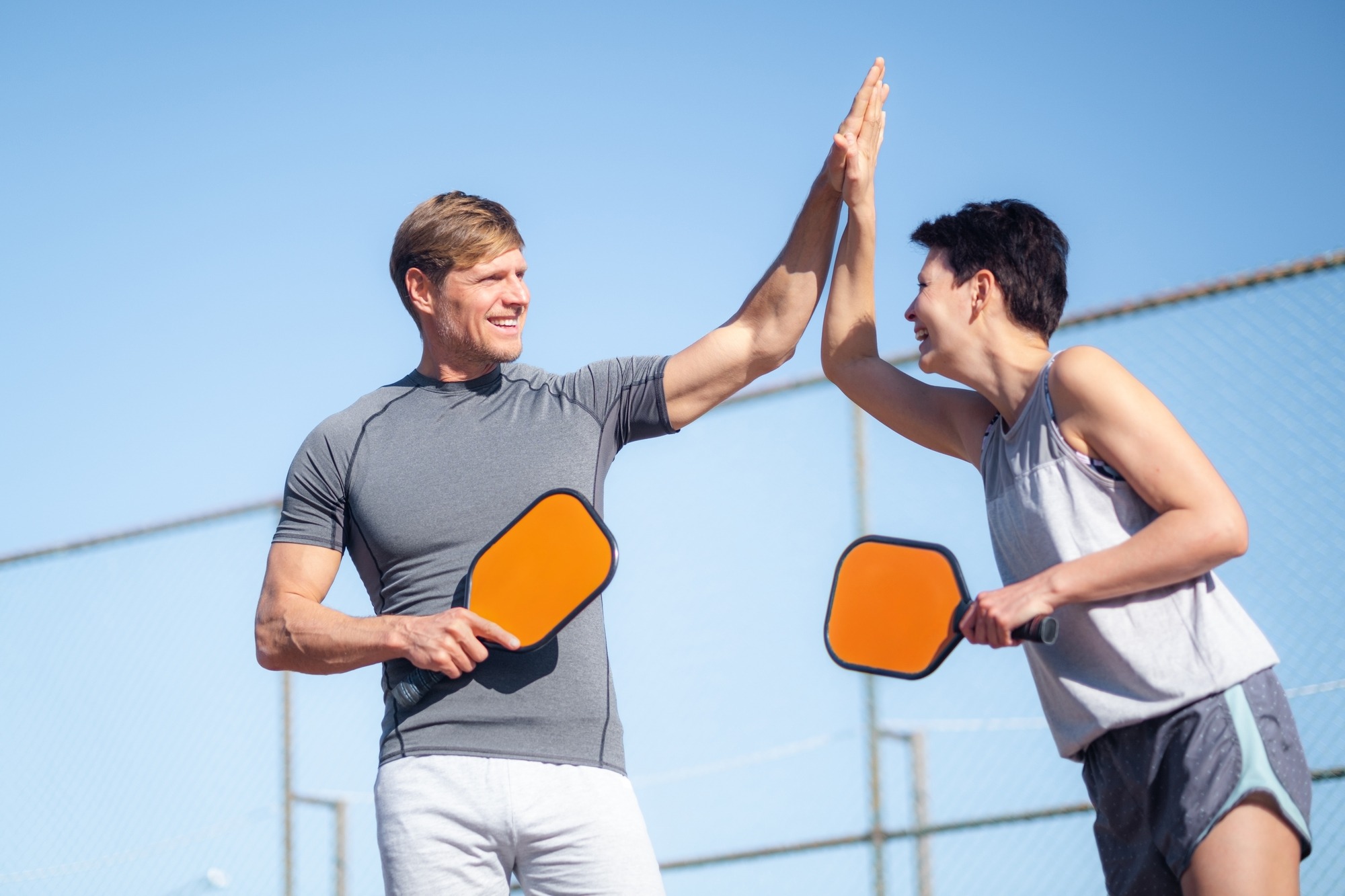 Couple playing pickleball game