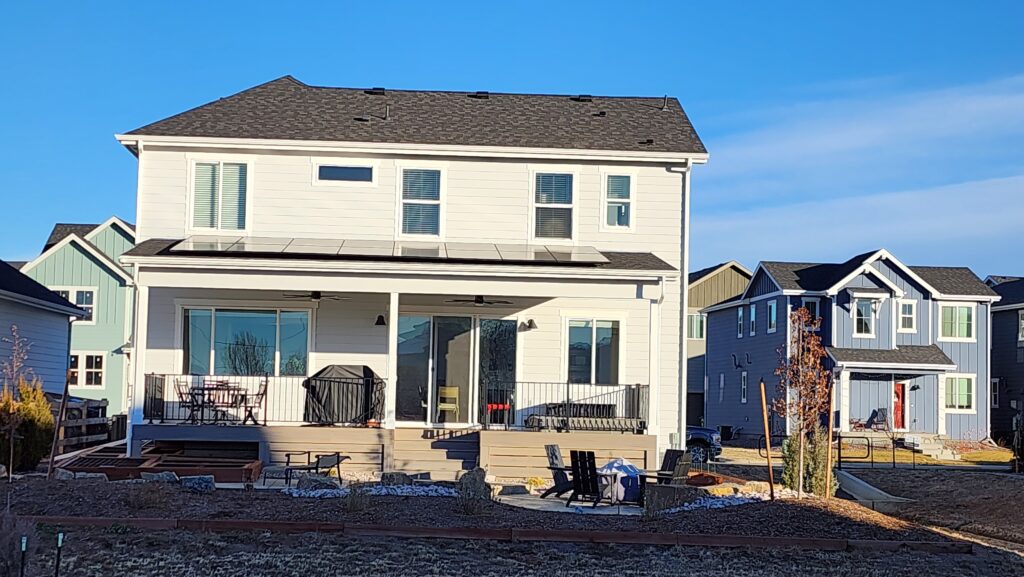 Front view of the exterior of a house with an underconstructed sadar deck